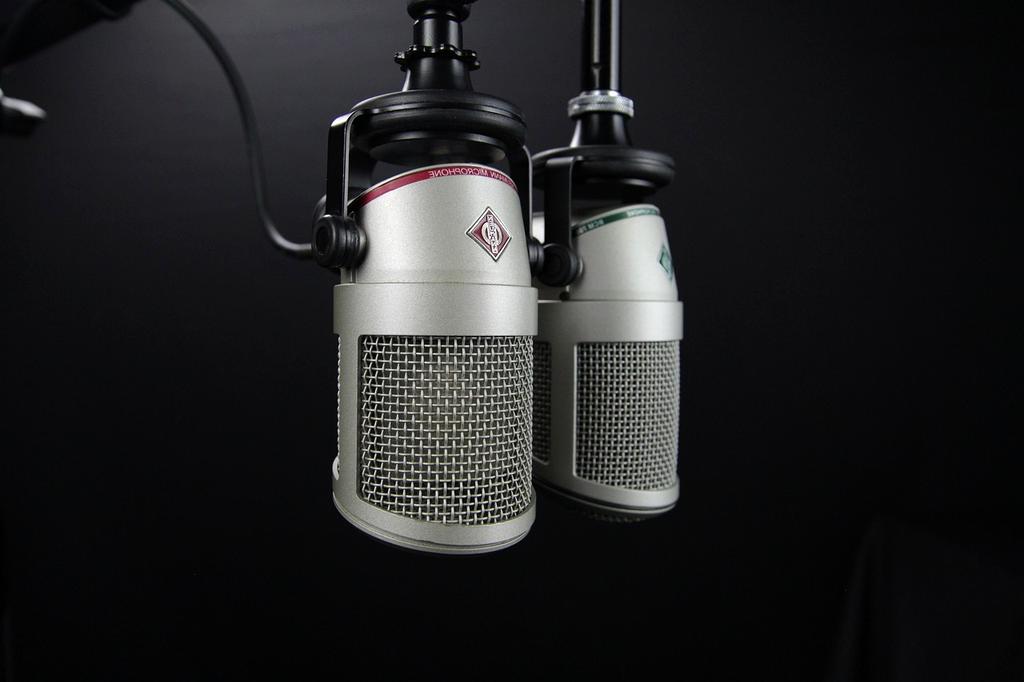 Podcast host recording in professional studio with AI enhancement technology