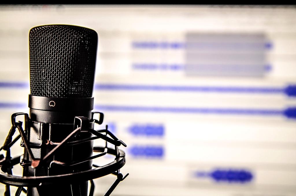 Content creator podcaster recording with professional AI voice enhancement setup